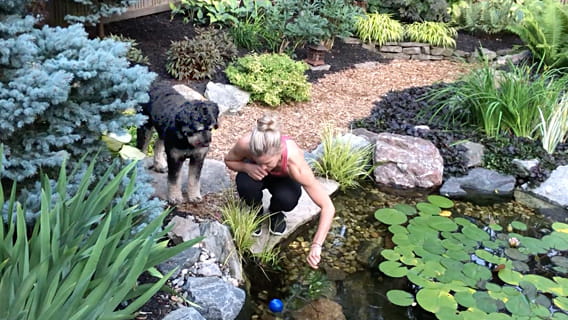 Nadine Buckley in her garden with Shilo